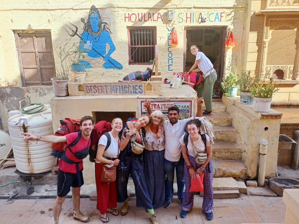 a group of people posing for a picture in front of a building at Shiva Guest House in Jaisalmer
