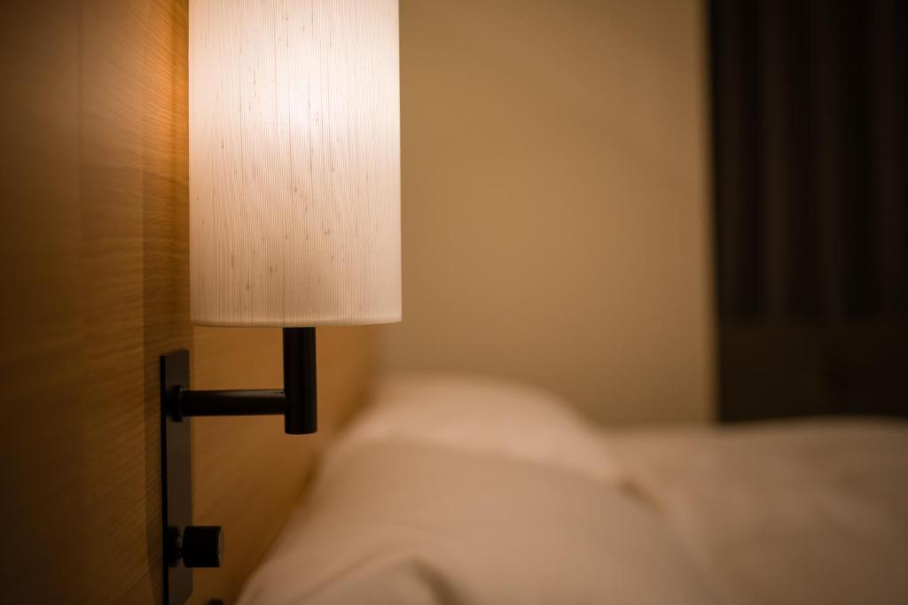 Tosei Hotel Cocone Ueno房間的床