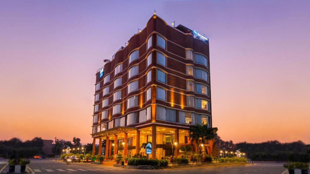 a rendering of a hotel at dusk at Best Western Merrion in Amritsar