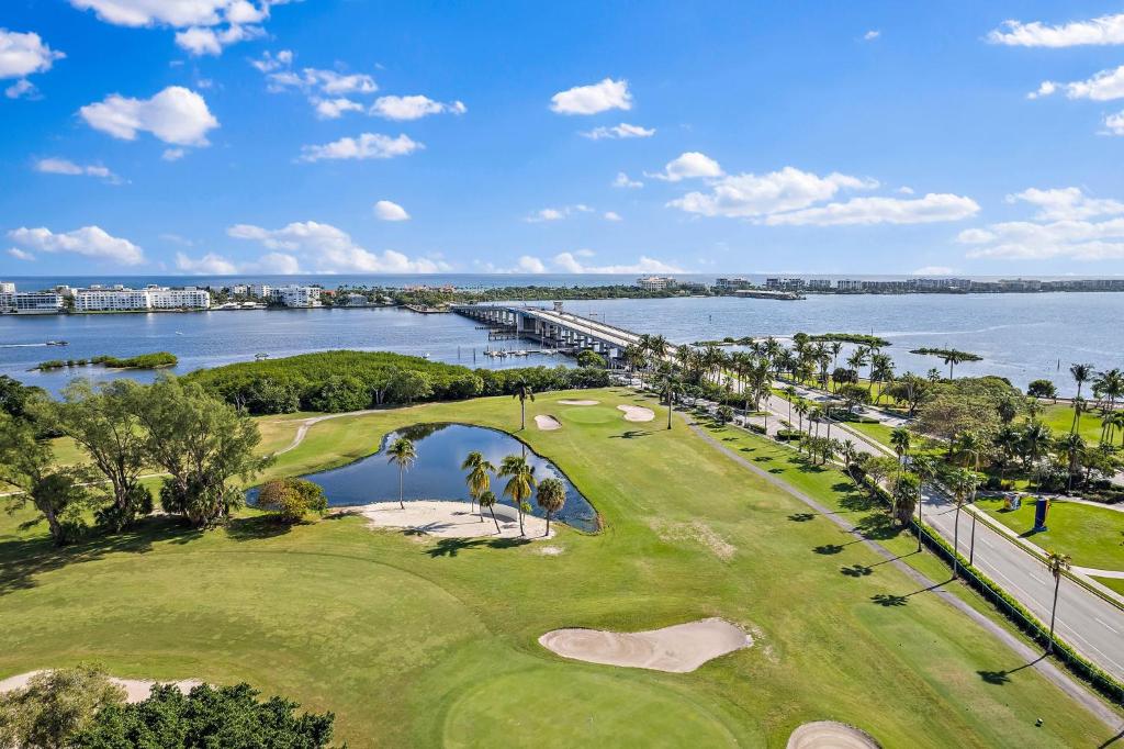 an aerial view of a golf course with the water at the Lucerne in Lake Worth