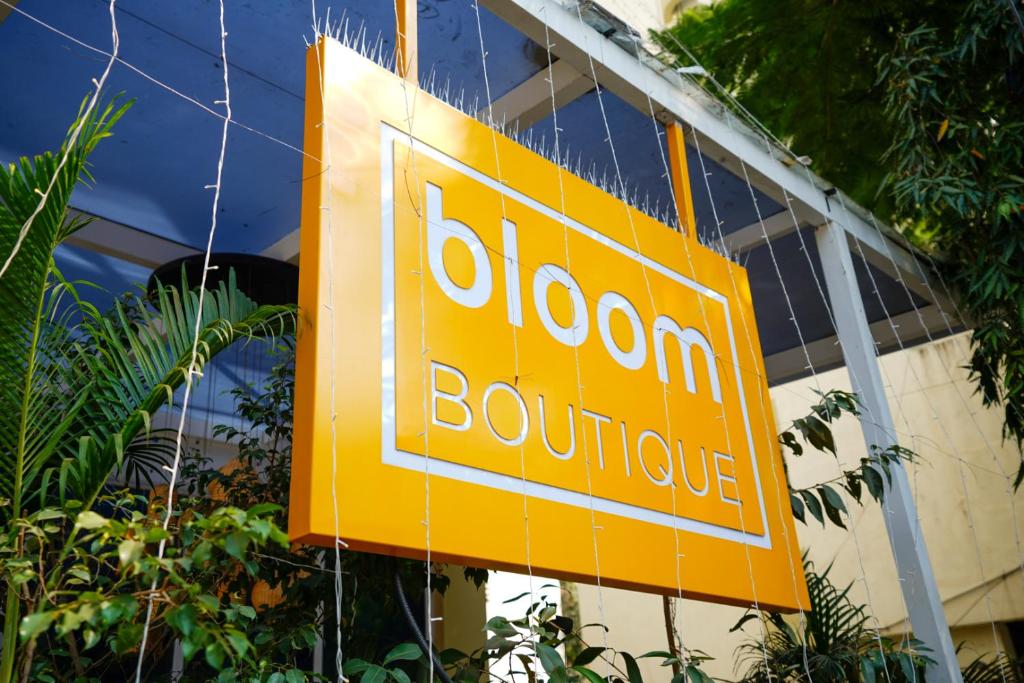 a yellow sign on the side of a building at Bloom Boutique - Bandra in Mumbai