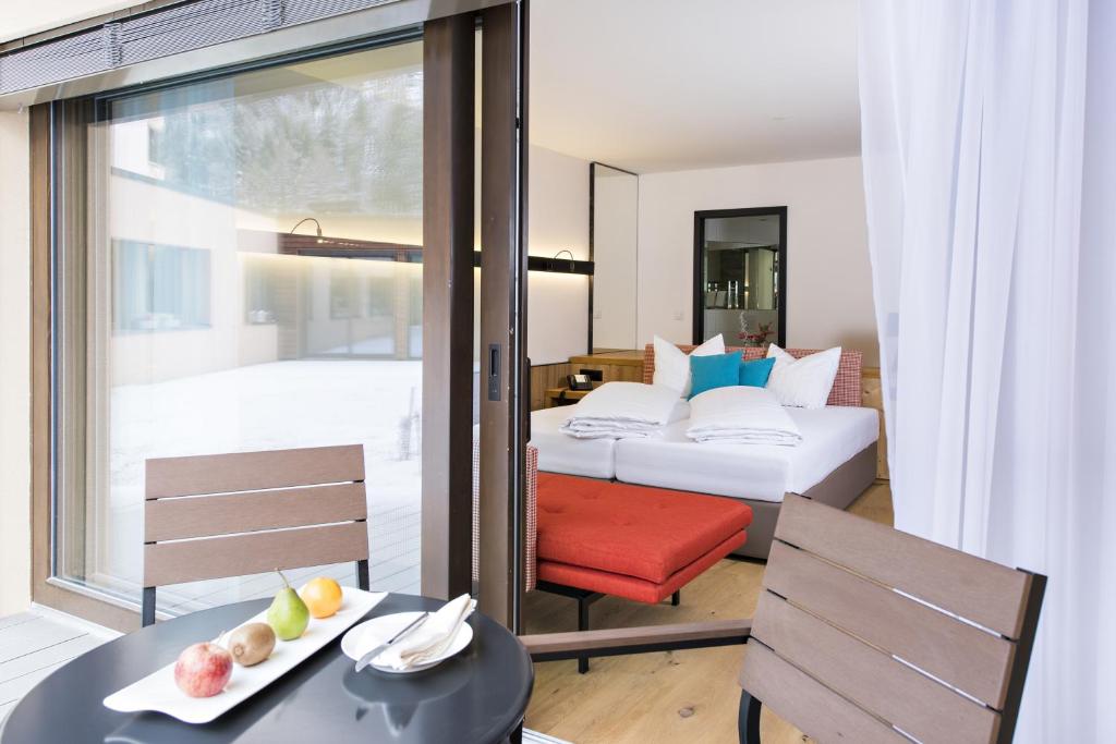Postel nebo postele na pokoji v ubytování Hotel Palü