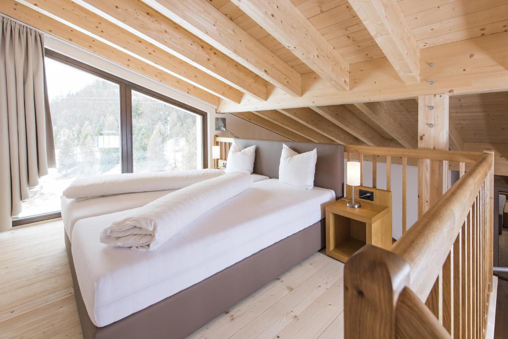 Postel nebo postele na pokoji v ubytování Hotel Palü
