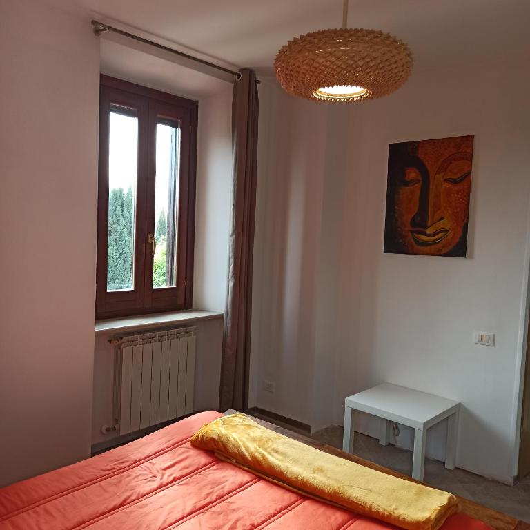 A bed or beds in a room at Appartamento fiera di roma e aereoporto fiumicino