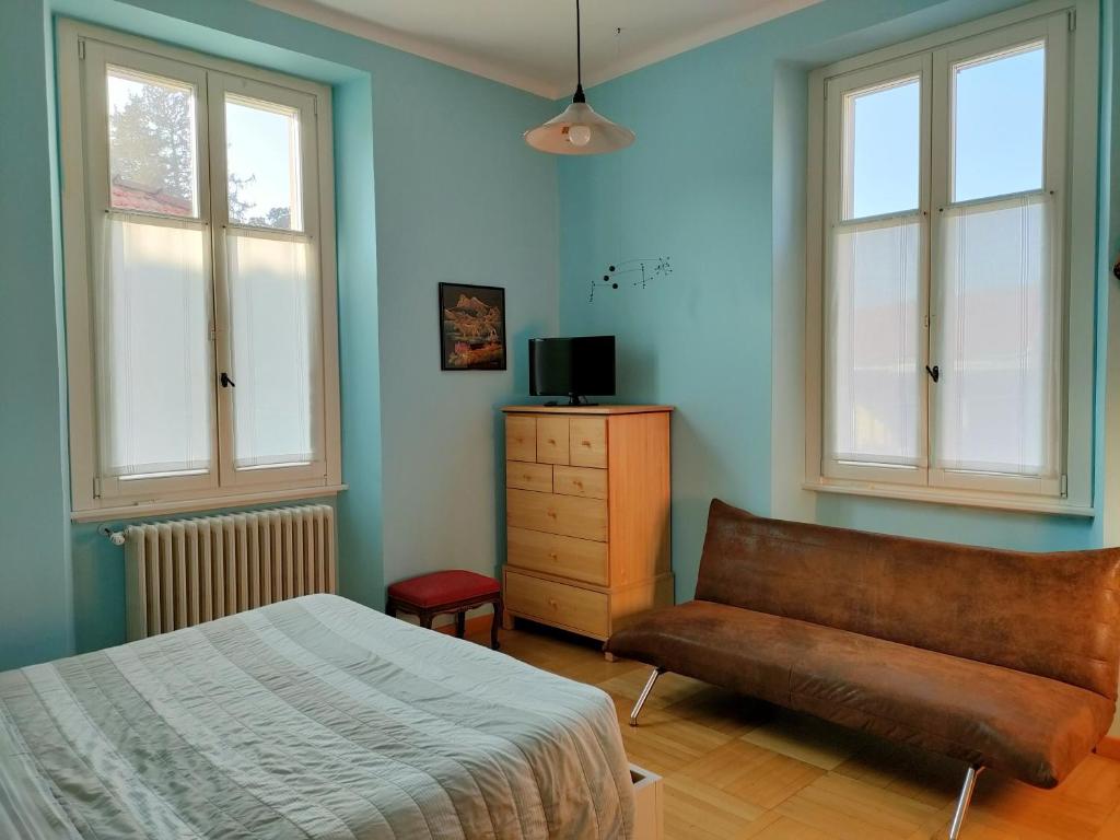 Postel nebo postele na pokoji v ubytování Villa Scalabrini