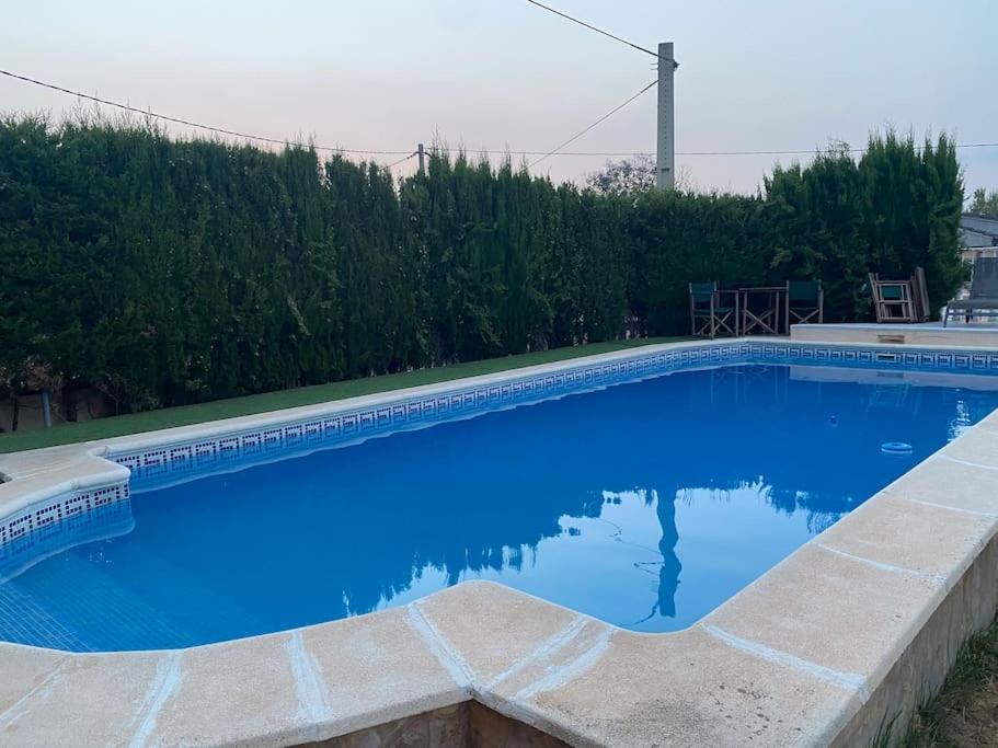Bassenget på eller i nærheten av Encantador y acogedor alojamiento con piscina