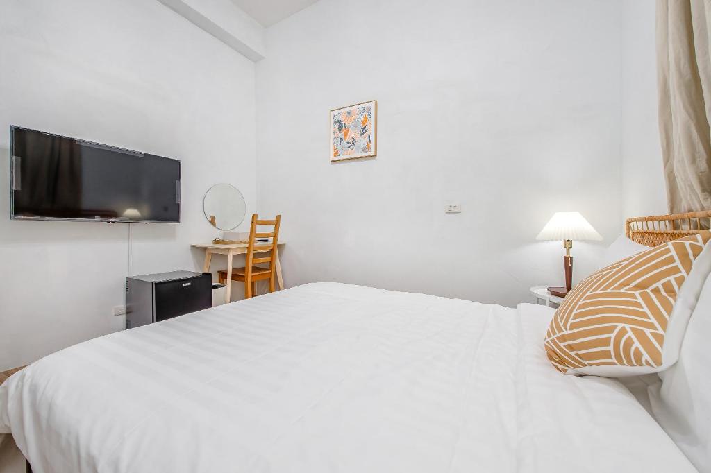 Letto o letti in una camera di Taitung Homeabout Pet Friendly Hall