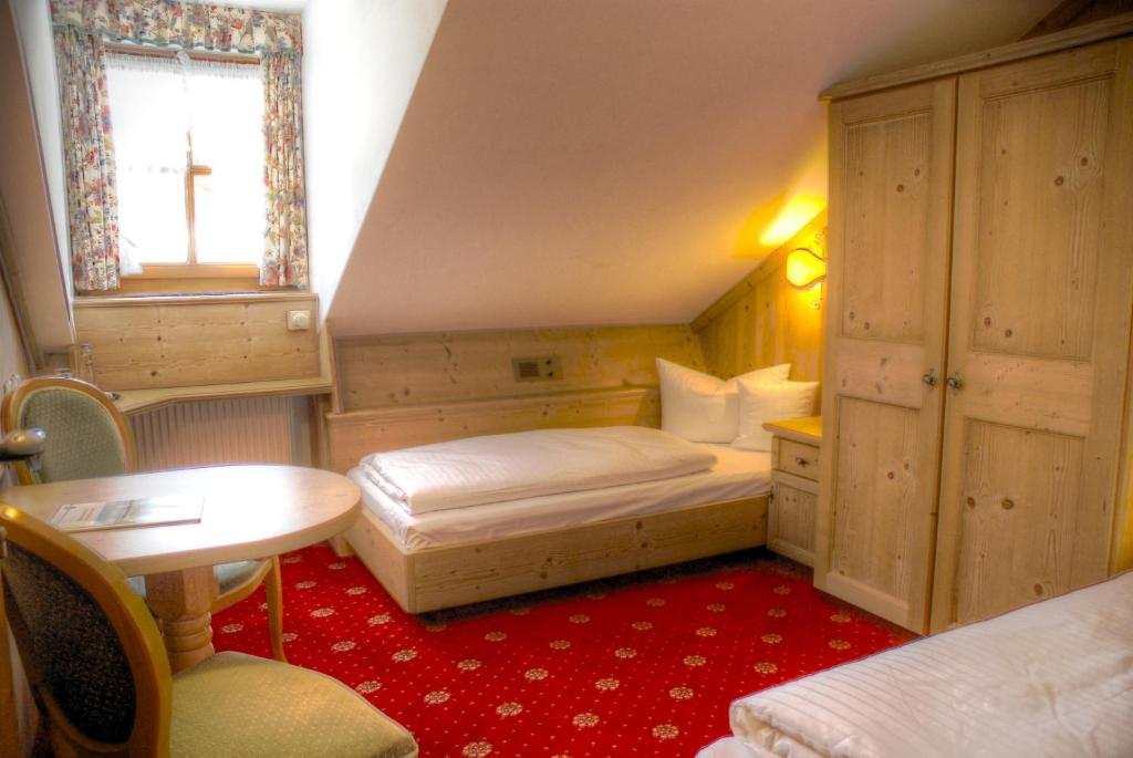 Postel nebo postele na pokoji v ubytování Hotel Hölzer Bräu by Lehmann Hotels