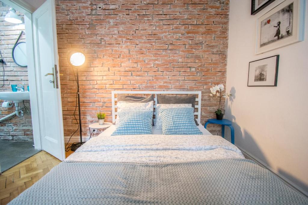 Posteľ alebo postele v izbe v ubytovaní LION apartments - Gold