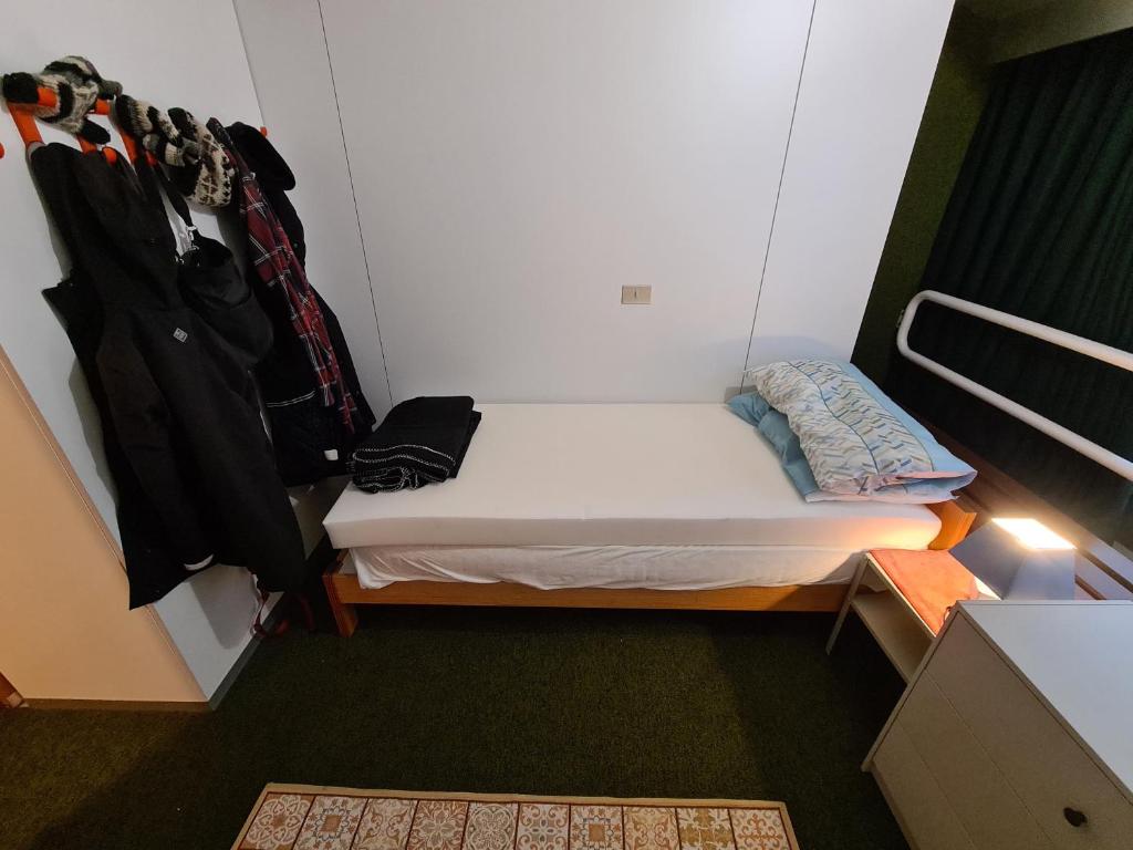 Postel nebo postele na pokoji v ubytování La casa di Ninis a Marilleva 1400