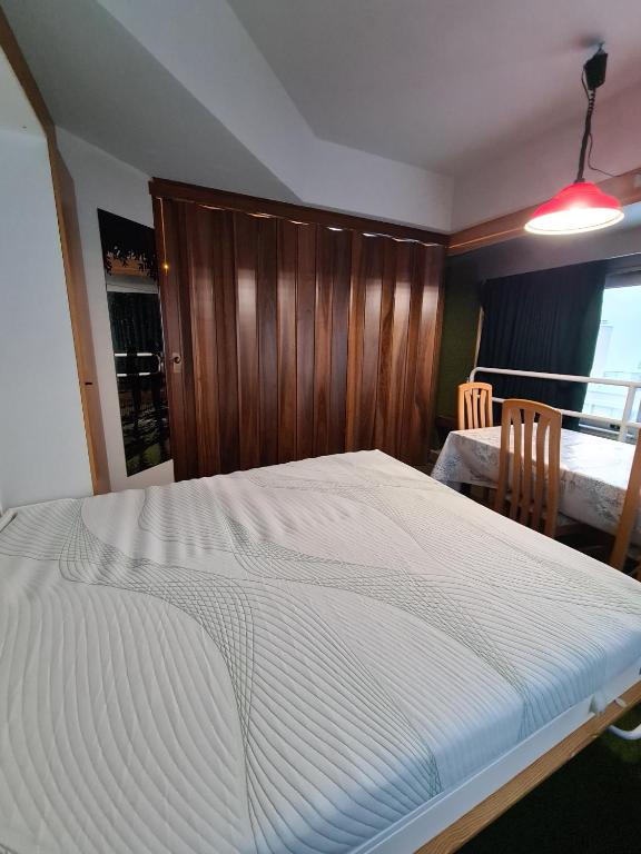 Postel nebo postele na pokoji v ubytování La casa di Ninis a Marilleva 1400
