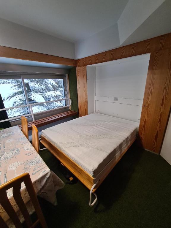 Postel nebo postele na pokoji v ubytování La casa di Ninis a Marilleva 1400