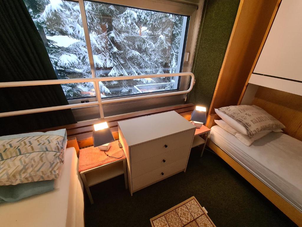 Postel nebo postele na pokoji v ubytování La casa di Ninis a Marilleva 1400