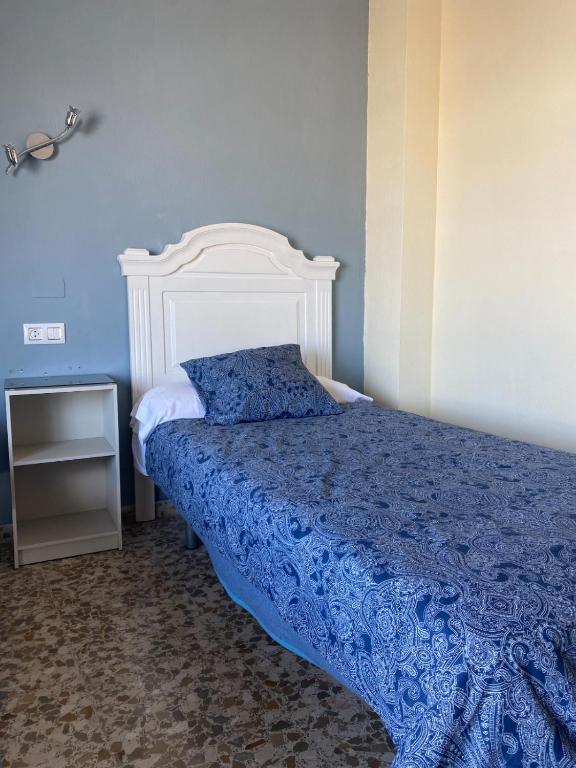 Postel nebo postele na pokoji v ubytování Hotel Medina Centro