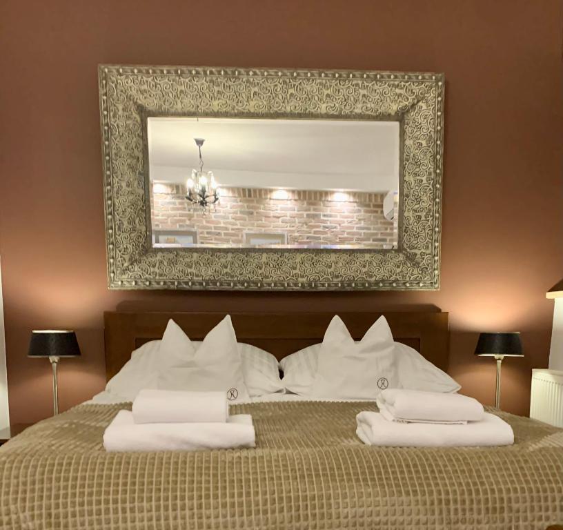 Posteľ alebo postele v izbe v ubytovaní Apartament Kawowy