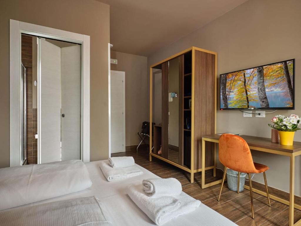 Postel nebo postele na pokoji v ubytování Hotel Giulietta