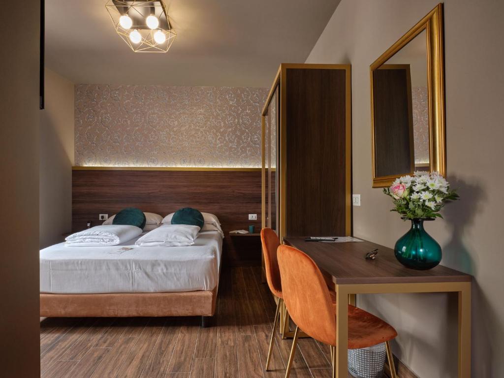 Postel nebo postele na pokoji v ubytování Hotel Giulietta