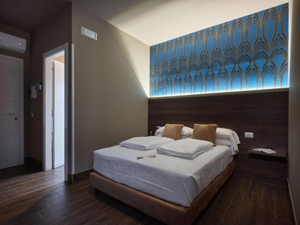Postel nebo postele na pokoji v ubytování Hotel Giulietta