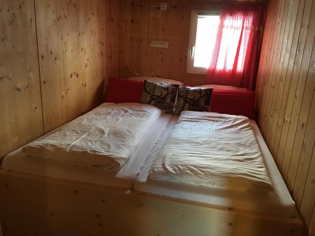 Postel nebo postele na pokoji v ubytování Feriendorf Tauerngast