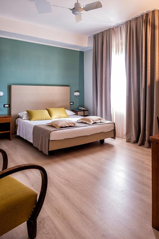 Postel nebo postele na pokoji v ubytování Albergo Cerchi