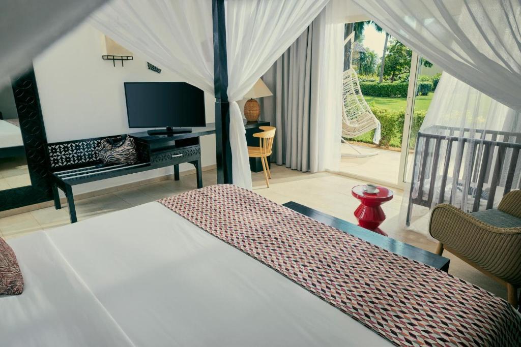 Кровать или кровати в номере TUI BLUE Bahari Zanzibar
