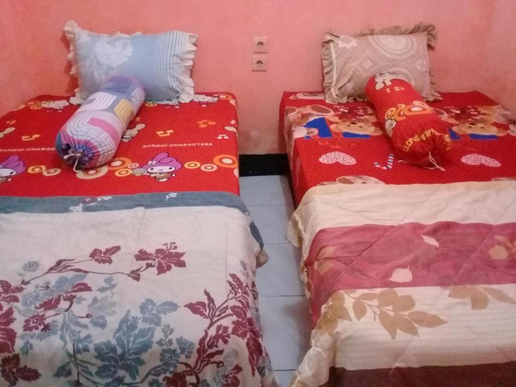 Postel nebo postele na pokoji v ubytování ADELYA HOMESTAY