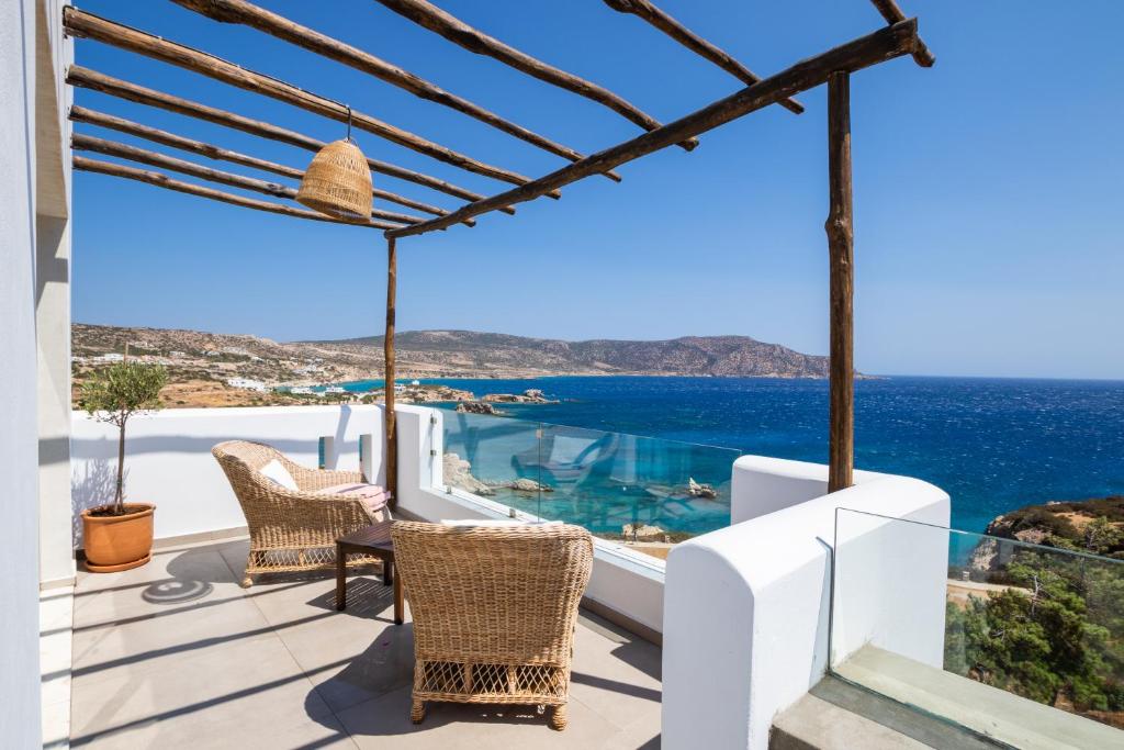 a villa with a view of the ocean at Aegean Village Beachfront Resort in Amoopi