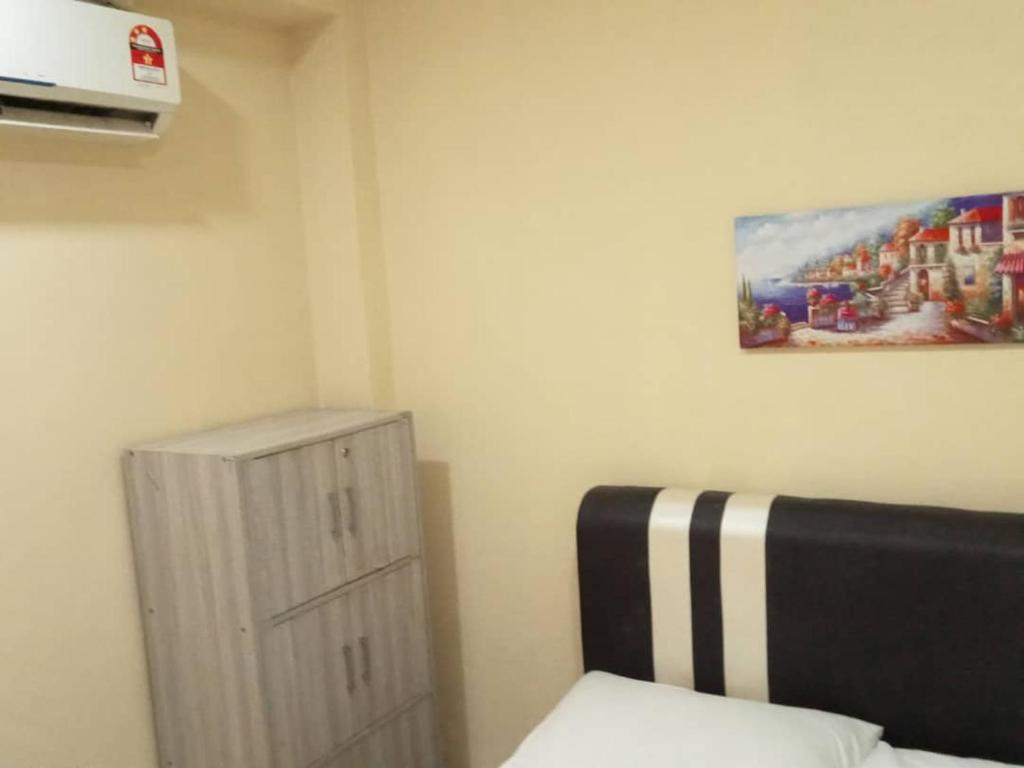 Postel nebo postele na pokoji v ubytování RAS Hotel