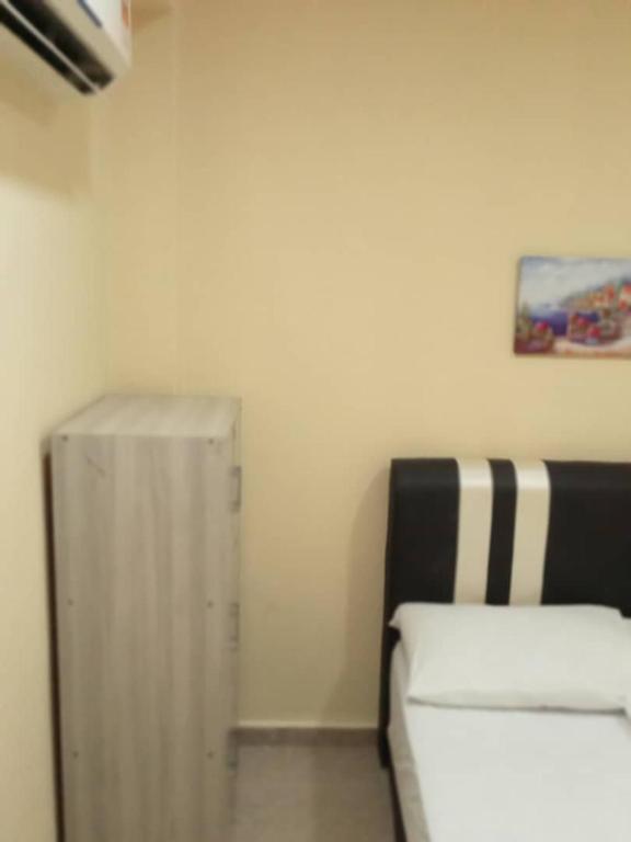 Postel nebo postele na pokoji v ubytování RAS Hotel