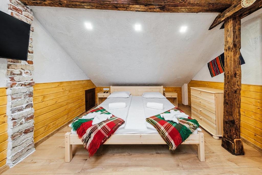 A bed or beds in a room at Sofia Folklore Life Apartment