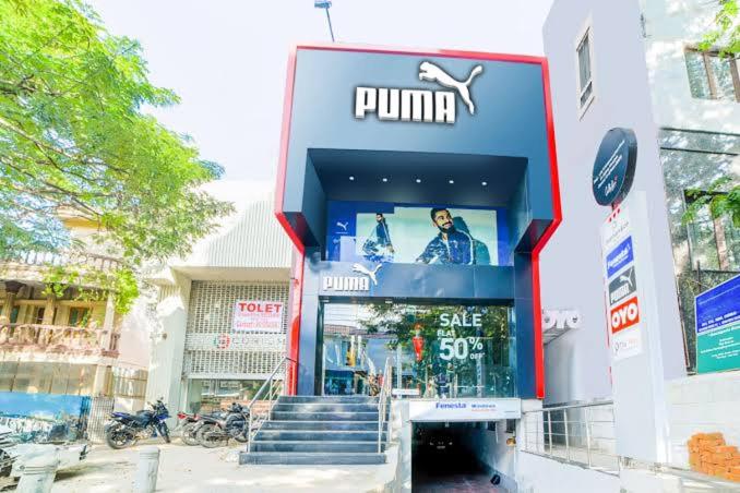 a puma store with a sign on the front of it at RAAJ PEARL in Chennai