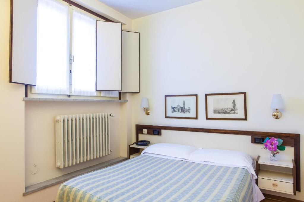 Posteľ alebo postele v izbe v ubytovaní Hotel San Marco