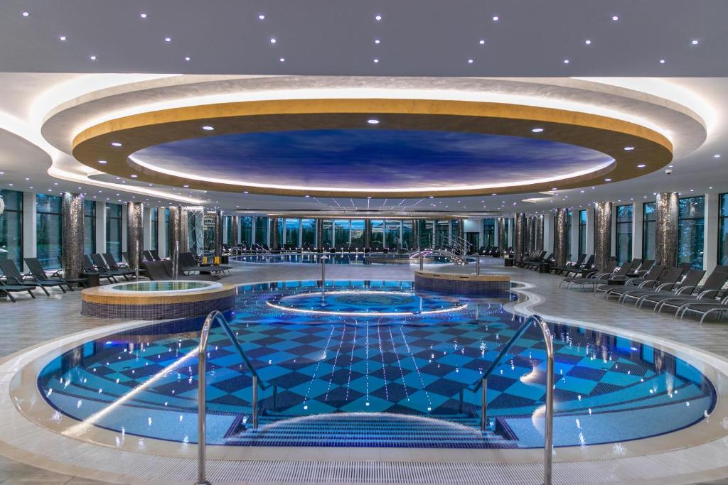 a large pool on a cruise ship at A Hoteli - Grand&Sky Hotel Tornik in Zlatibor
