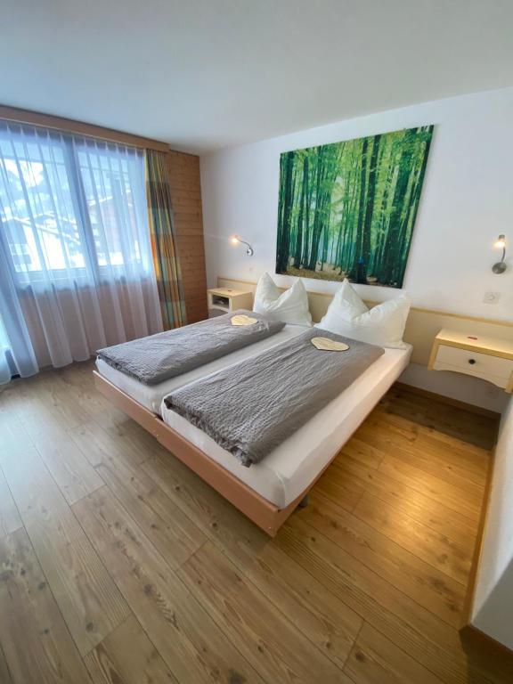 Postel nebo postele na pokoji v ubytování Hotel Garni Jägerhof