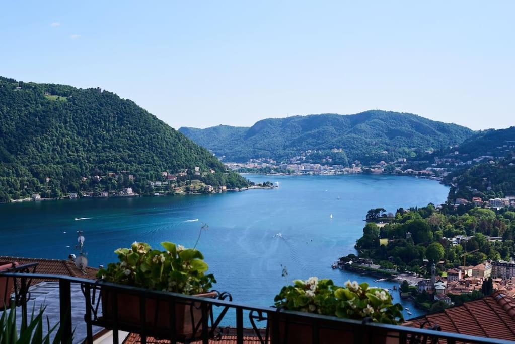 a view of a lake from a balcony at F&F vista Lago in Cernobbio