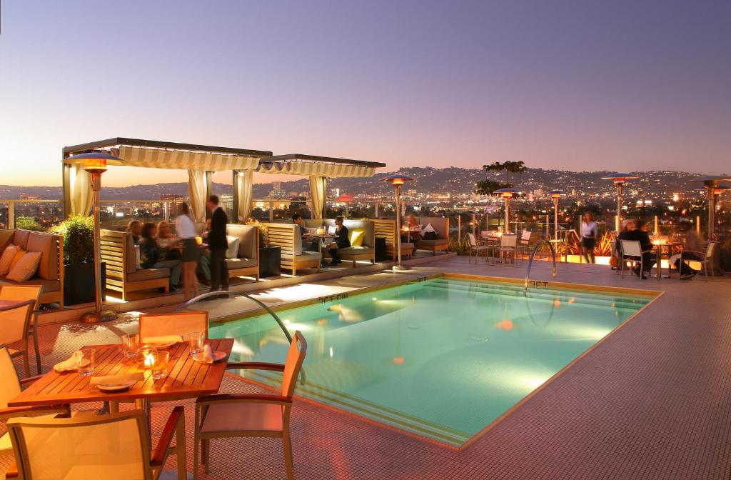 a swimming pool on the roof of a hotel at Kimpton Hotel Wilshire, an IHG Hotel in Los Angeles