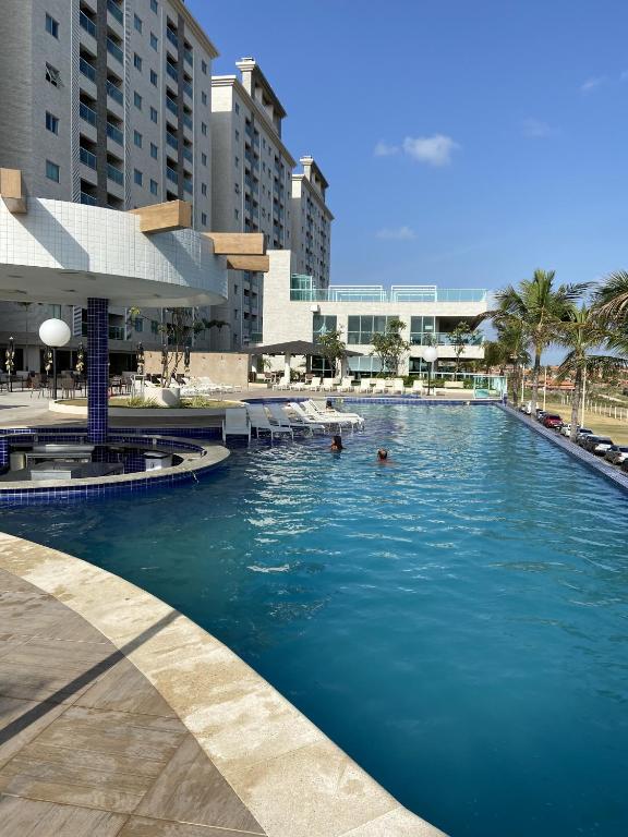 a swimming pool in the middle of a resort at SALINAS PARK RESORT in Salinópolis