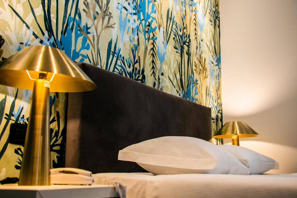 Postel nebo postele na pokoji v ubytování Hotel Up Wellness & Spa