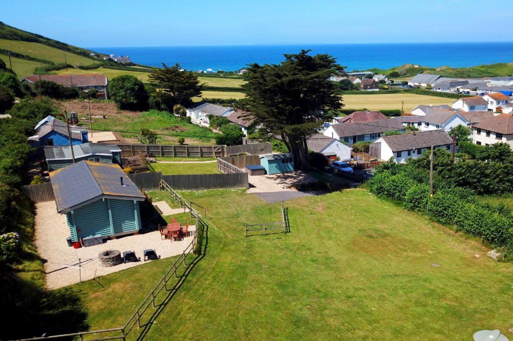 an aerial view of a village with a house and the ocean at CROYDE RANCH CHALET 2 Bedrooms in Croyde