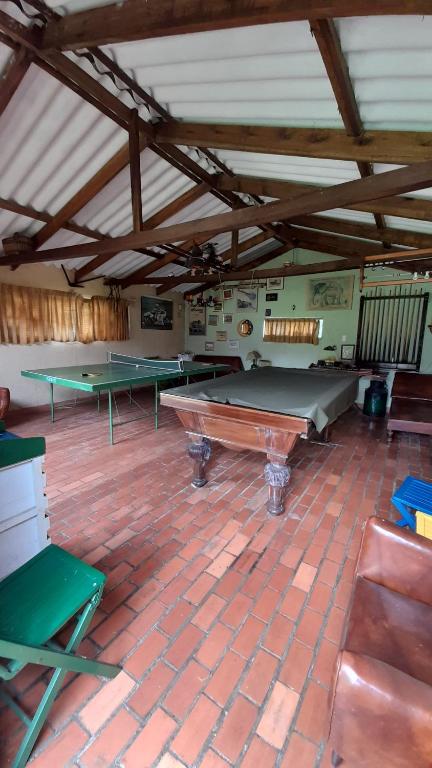 a large room with ping pong tables in it at La finca del Abuelo in Fúquene
