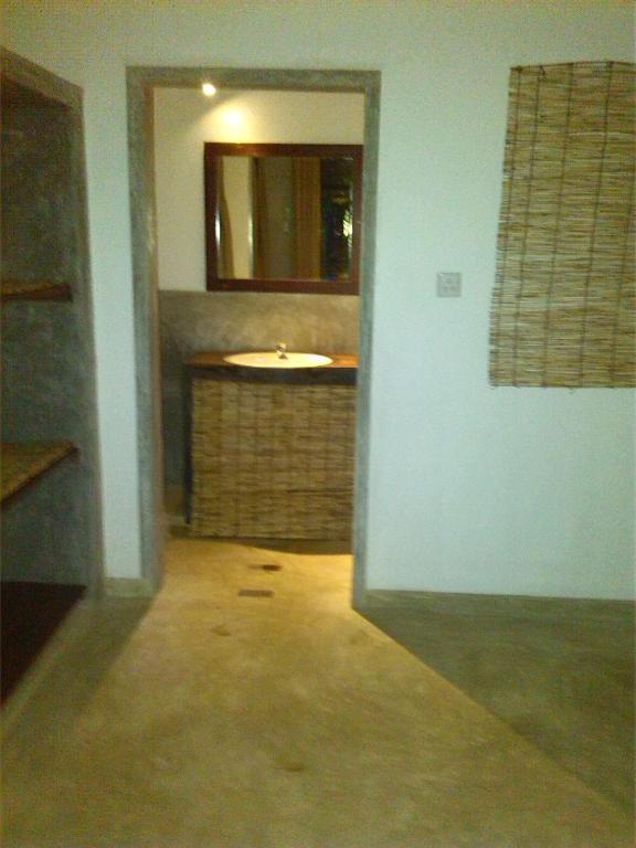 a bathroom with a sink and a mirror at Silva Rest in Unawatuna