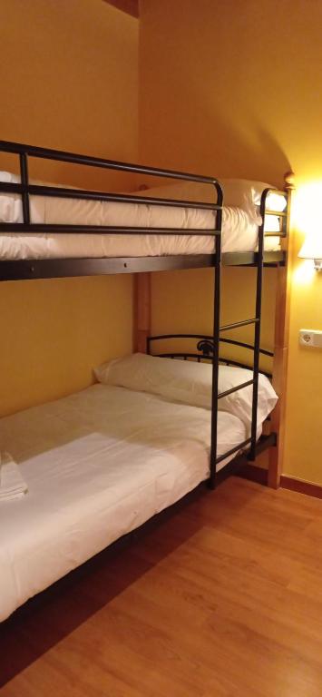 Postel nebo postele na pokoji v ubytování Hotel Golf Natura