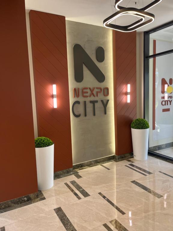 a new york city lobby with a n new york city sign at Аренда квартиры 2 in Prigorodnyy