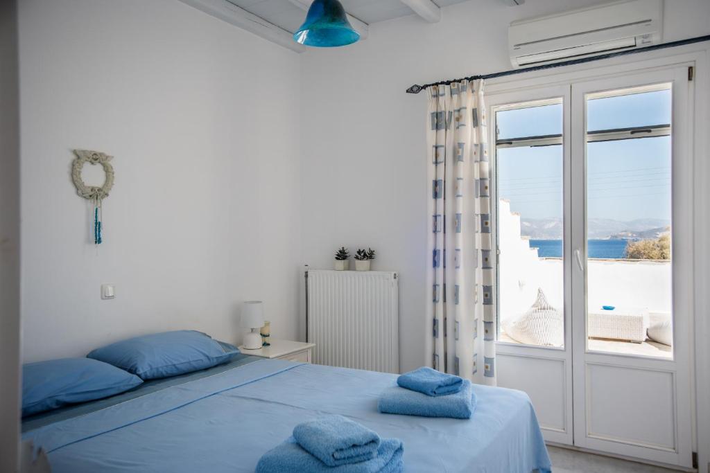 Posteľ alebo postele v izbe v ubytovaní Eternity Seafront Villa Awakening Senses