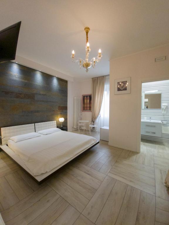 Łóżko lub łóżka w pokoju w obiekcie Al Teatro Suites