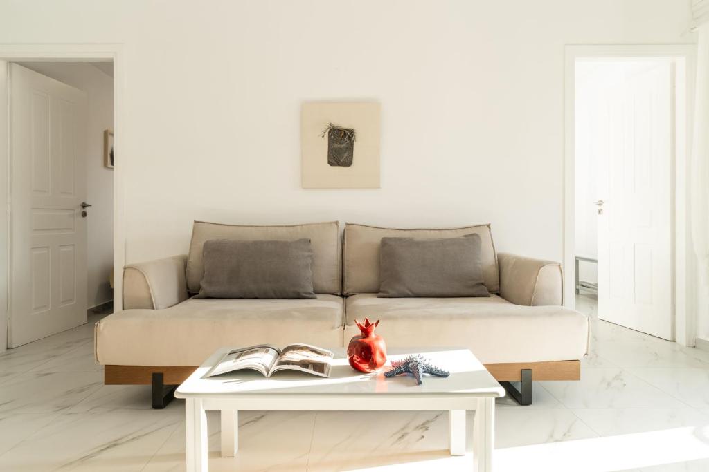 a living room with a couch and a table at Alasthas in Gavrio