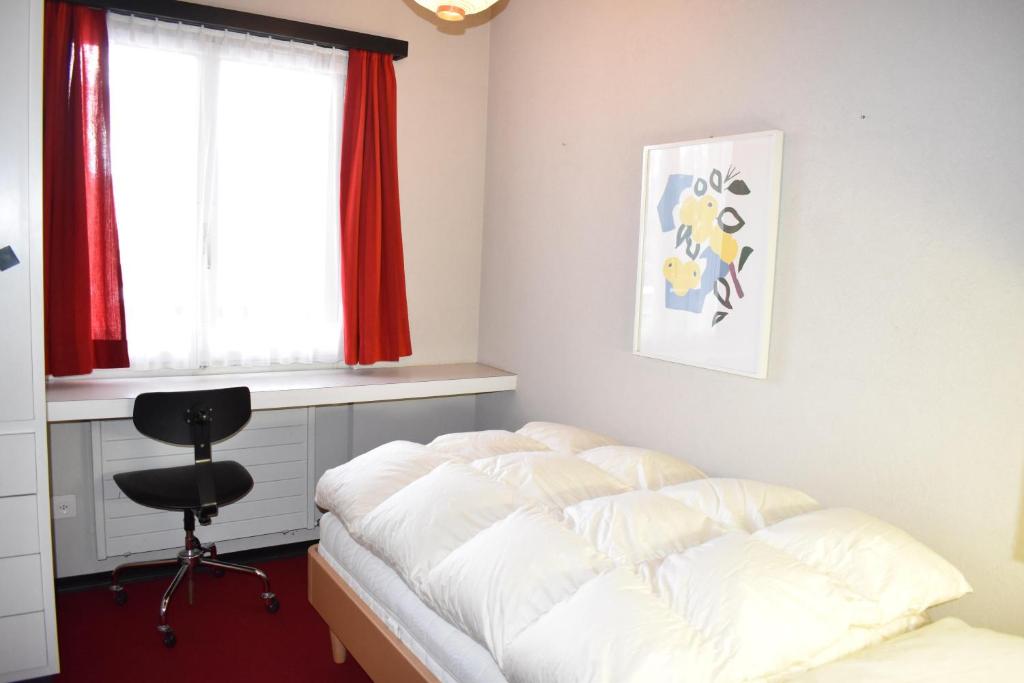 Postel nebo postele na pokoji v ubytování Arp (470 Bä) OG