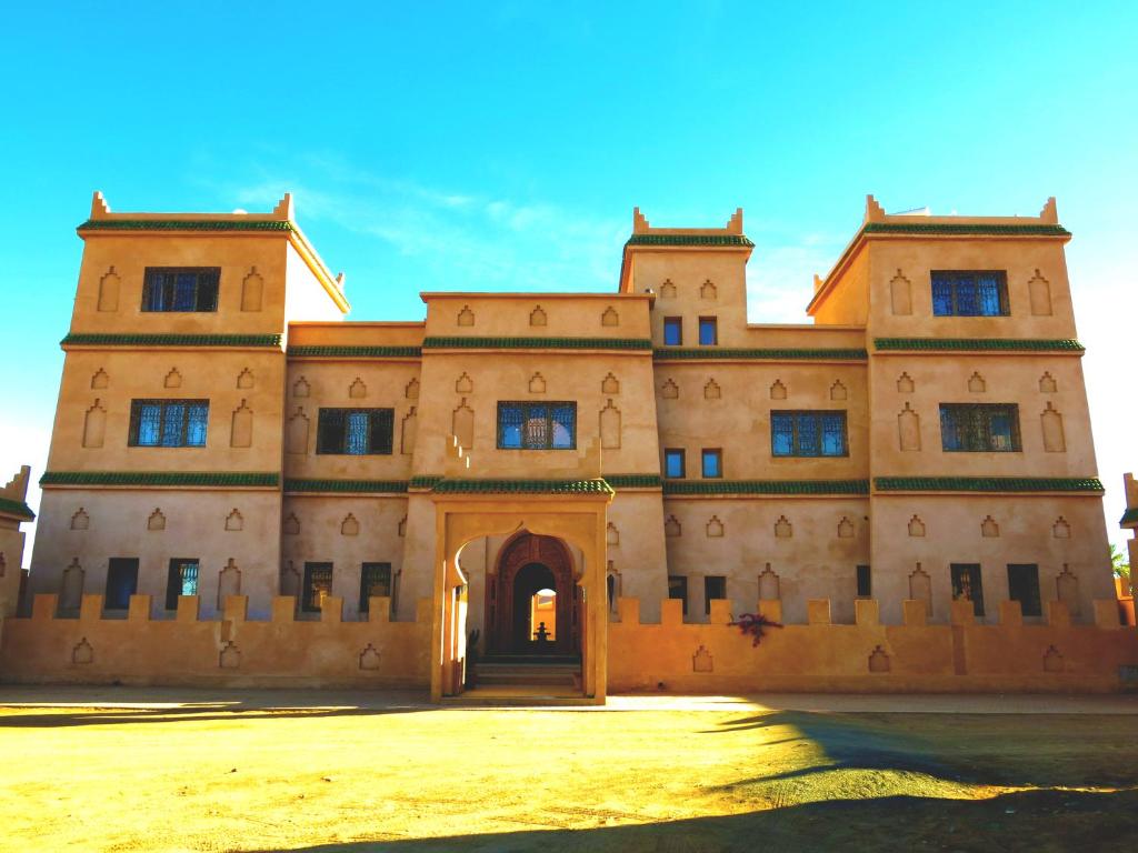 a large building with a door in the front at Desert Villa Boutique Hotel Merzouga in Merzouga