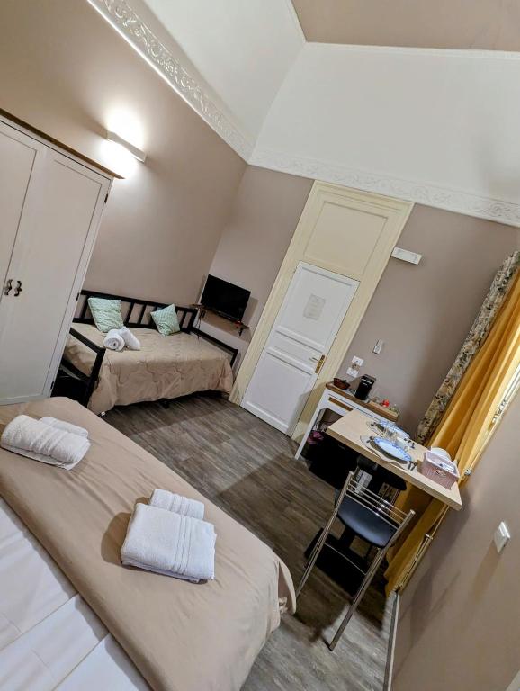 Łóżko lub łóżka w pokoju w obiekcie B&B Benincasa