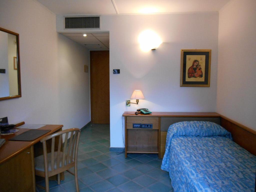 Postel nebo postele na pokoji v ubytování Hotel Pagnani
